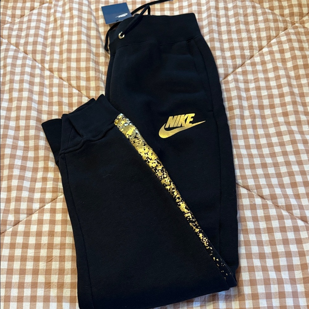 Nike Women Black Joggers with Gold Accents